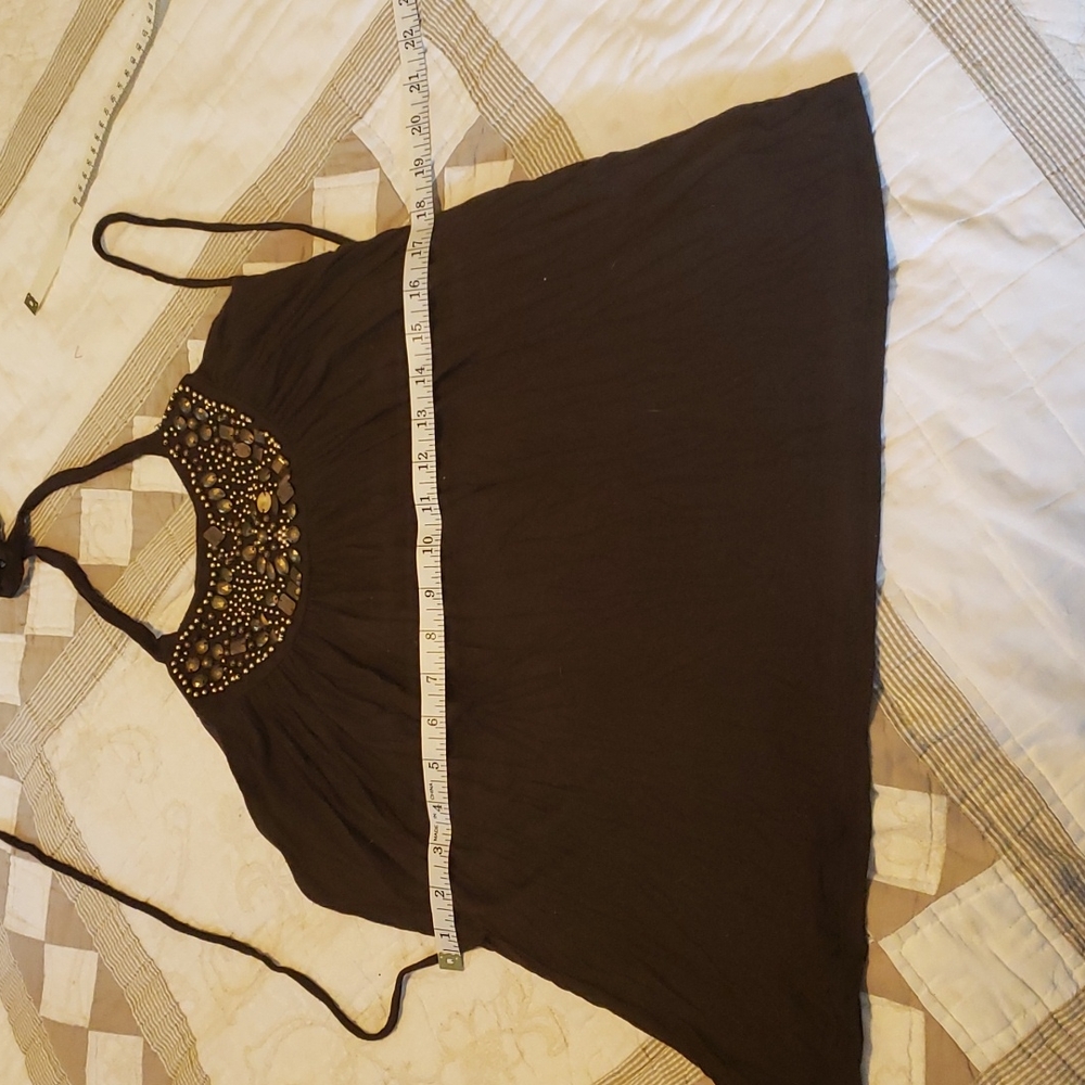Cute halter top. Embellished on front. Ties for neck and waist.